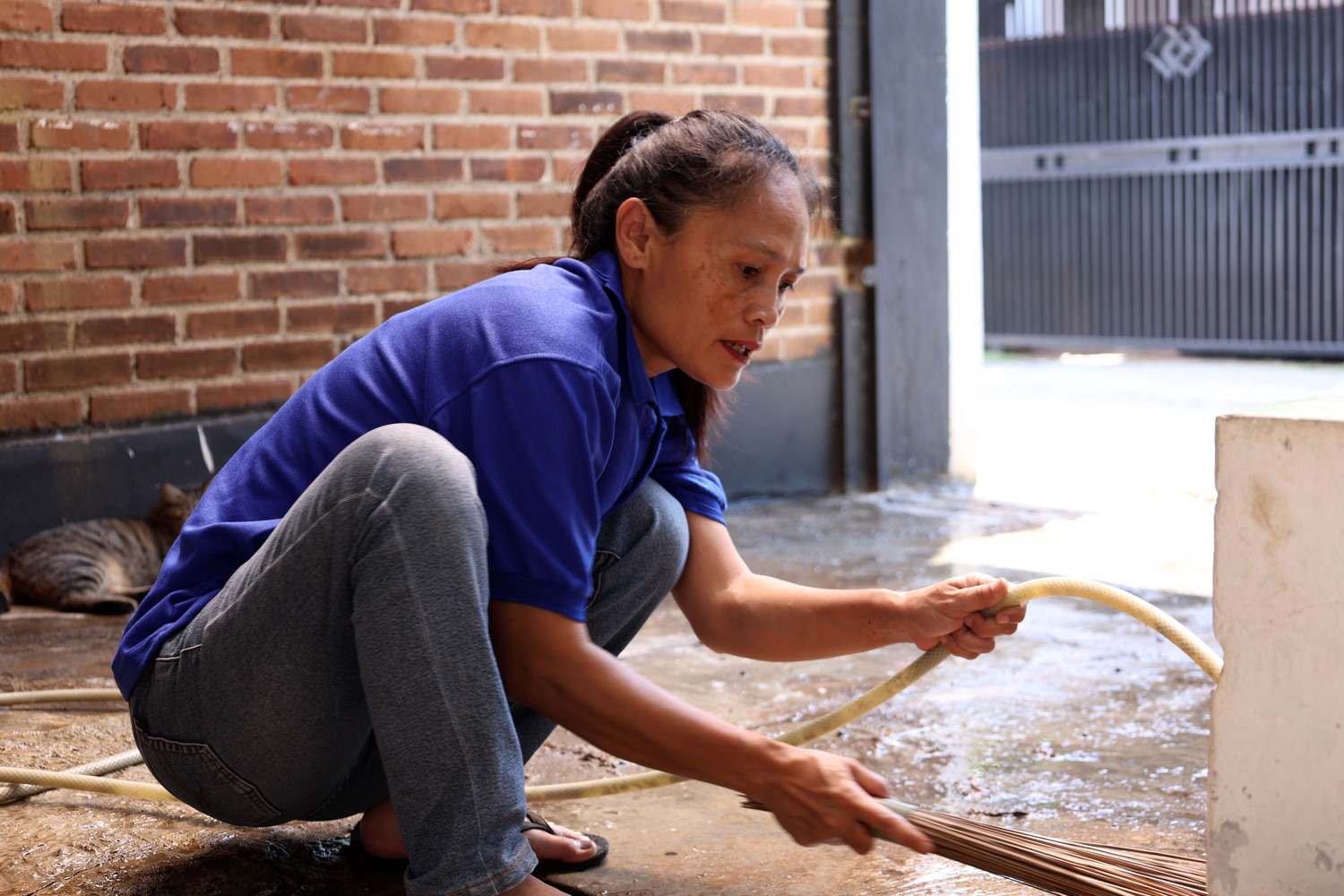 Water damage cleanup technician working on flooded floor