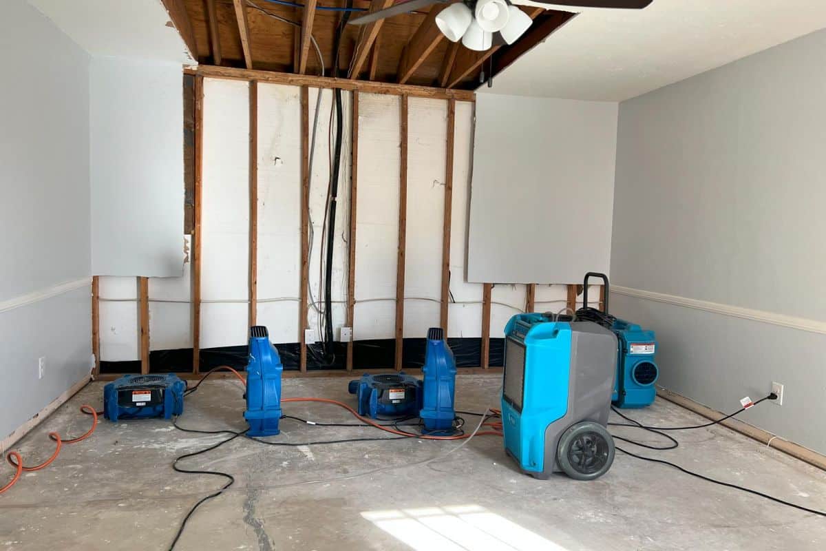 Professional structural drying equipment set up in a water-damaged room during restoration in Redondo Beach